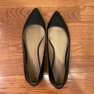 Black leather pointed flats